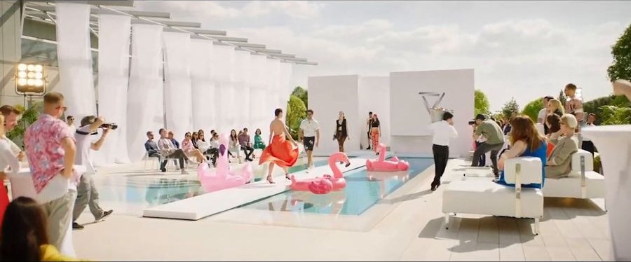 The poolside set, white colonnade and flamingos