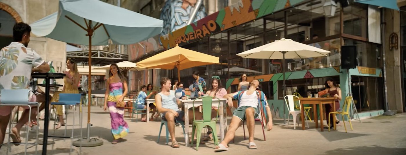 The terrace set under painted signage