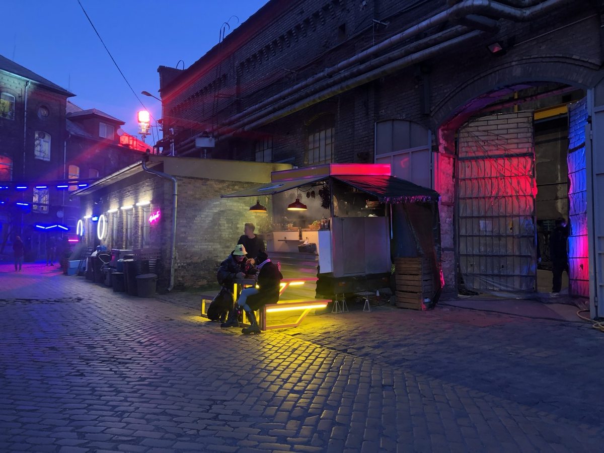 Neon-lit street set built for a night campaign