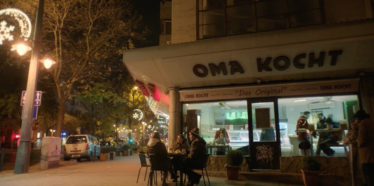 Berlin Blues — a lit shopfront on the street at night, dressed as Berlin